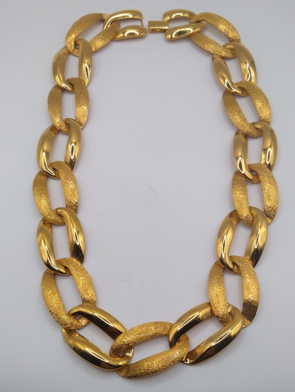 Napier Gold Tone Large Link Necklace With A Textured And Shiny Pattern